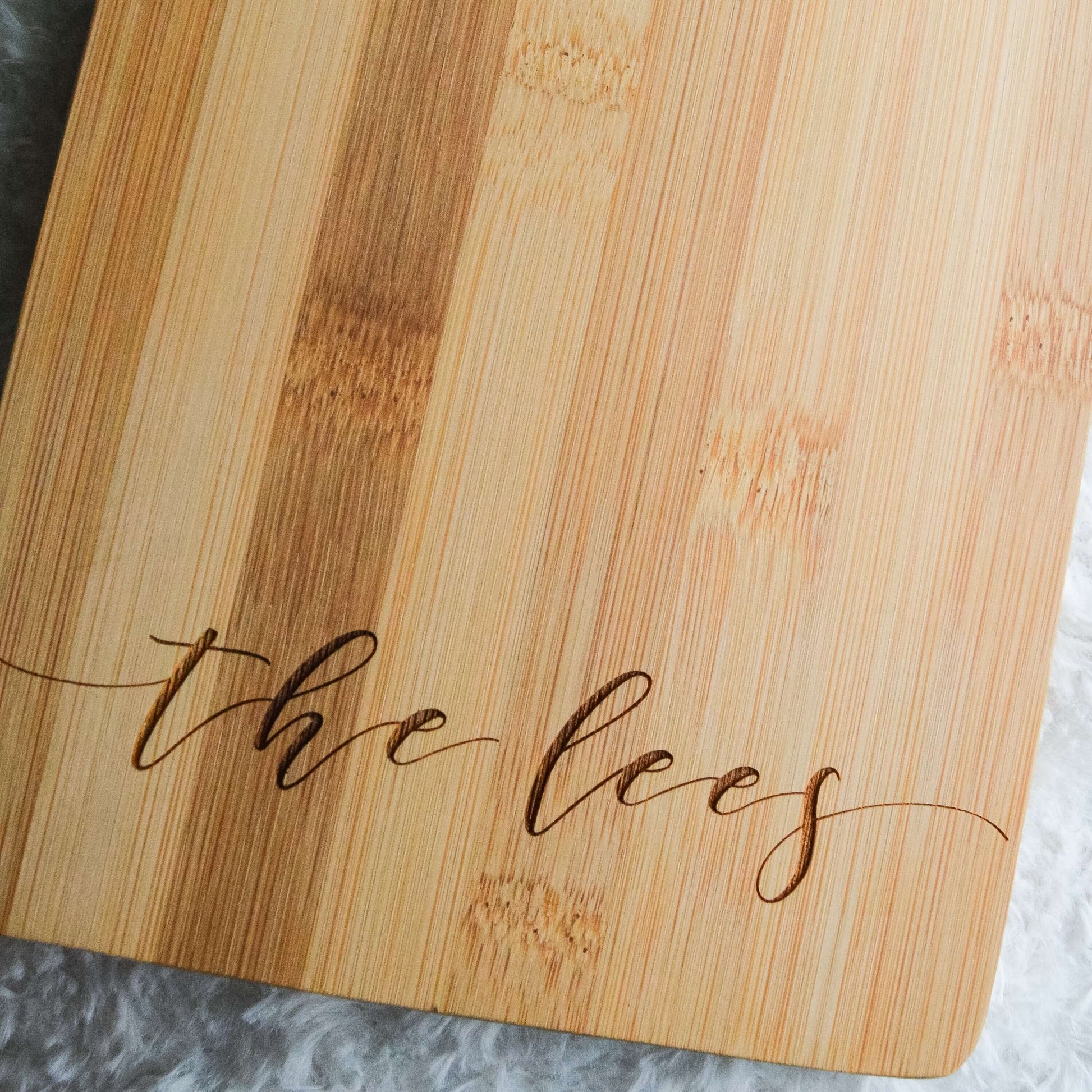 Engraved bamboo wood serving board, personalized wedding housewarming realtor gift with script family name